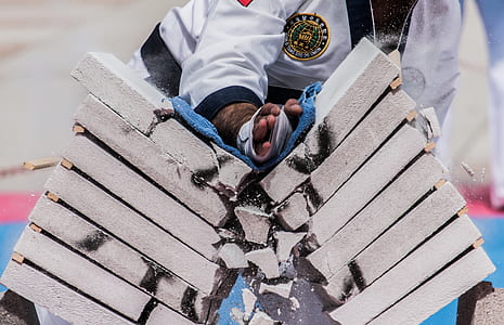 person smashing pile of blocks using hand thumbnail