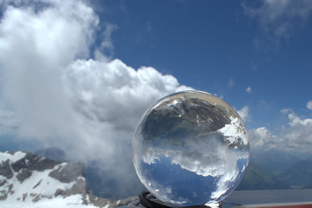 photography of glass ball on black textile thumbnail