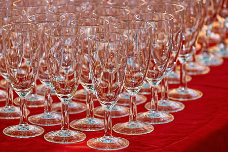 clear wine glass lot on red textile thumbnail