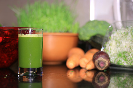 selective focus photography of clear drinking glass filled with green liquid thumbnail