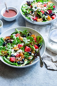 vegetable salad on white ceramic plates thumbnail