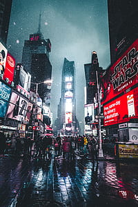 portrait photography of people between buildings thumbnail