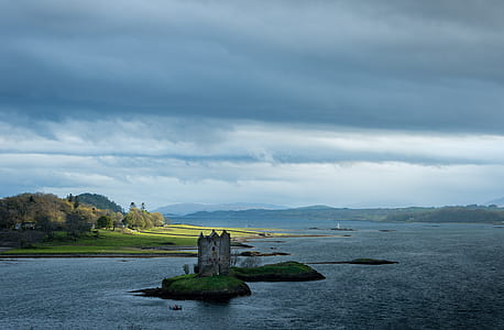 small island beside body of water thumbnail