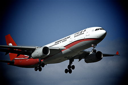 white and red airplane on sky at daytime thumbnail