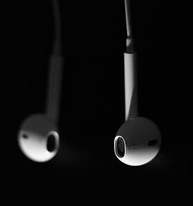 Apple EarPods against black background thumbnail