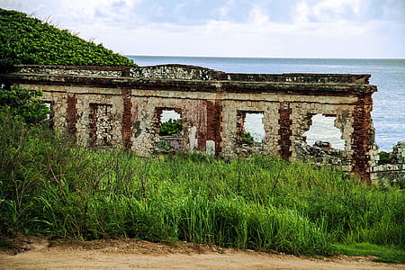 ruins beside sea at daytime thumbnail