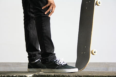 man holding skateboard thumbnail