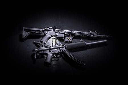 Photo of Two Black Assault Rifles, Knife, and bullets thumbnail