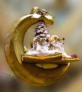 angel playing trumpet in crescent moon ornament thumbnail