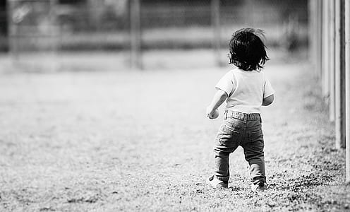 child walking near fence thumbnail