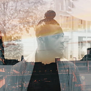 man in cardigan reflection on glass window thumbnail