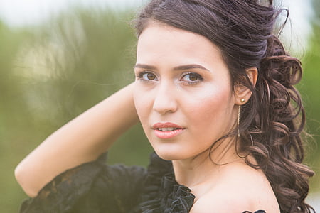 woman in white top posing for photo thumbnail