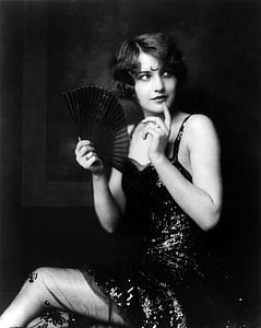 grayscale photo of woman wearing black dress thumbnail