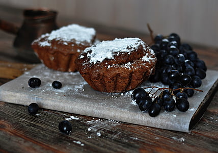 baked cupcakes beside blackberries thumbnail