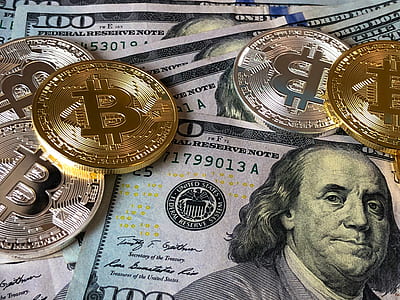 Bitcoins and U.s Dollar Bills thumbnail