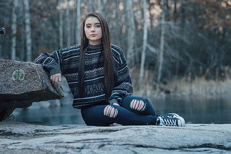 woman leaning on rock thumbnail