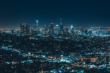panoramic photo of lighted city buildings thumbnail