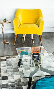 glass coffee table near fabric sofa chair thumbnail