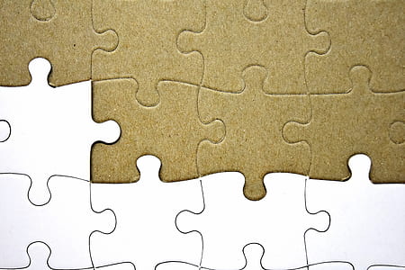 closeup photo of brown and white puzzle thumbnail