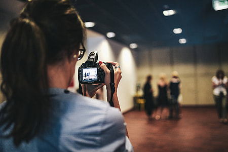 People with cameras at an exhibition thumbnail