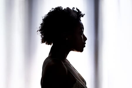 silhouette of woman inside room thumbnail