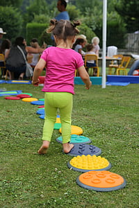 girl playing on plastic inline boards thumbnail