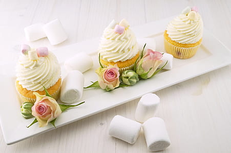 three cupcakes served on white ceramic plate thumbnail