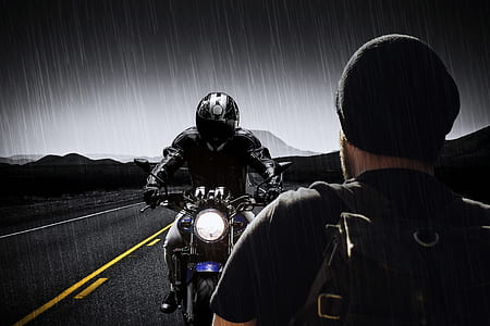 rider in black and gray full-face motorcycle helmet riding black and blue naked motorcycle thumbnail