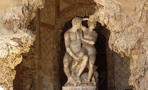 naked man and woman statue inside structure thumbnail
