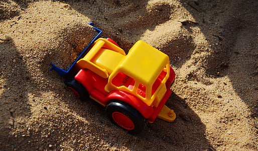 yellow, red, and black plastic pay loader toy thumbnail