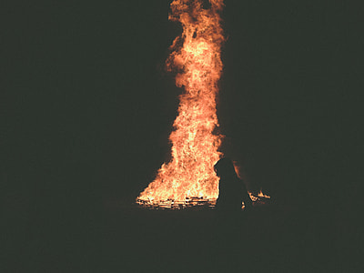silhouette of person near bonfire thumbnail