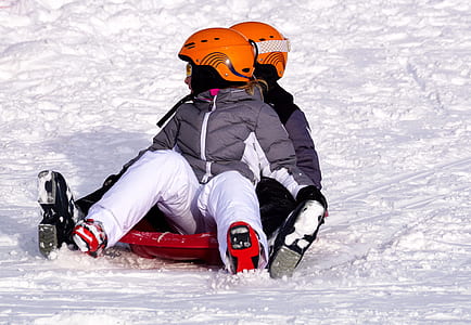 two person riding on sled thumbnail