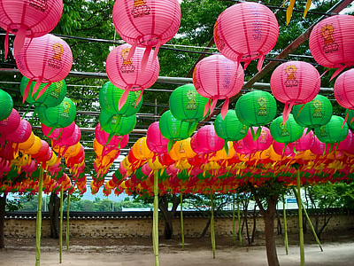 assorted-color paper lanterns hanging on strings thumbnail
