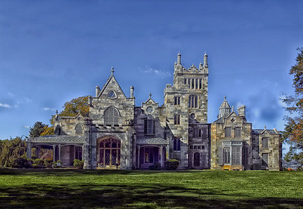 gray castle near tree under blue sky at daytime thumbnail