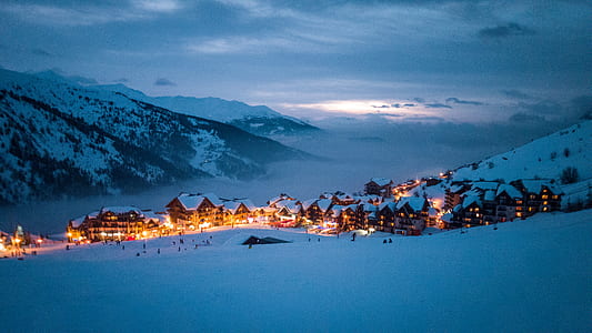 low light photography of village in snowfield thumbnail
