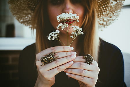 Woman Holding White Flowers thumbnail