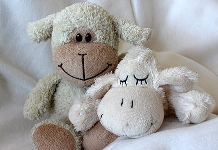 closeup photo of white sheep plush toys thumbnail