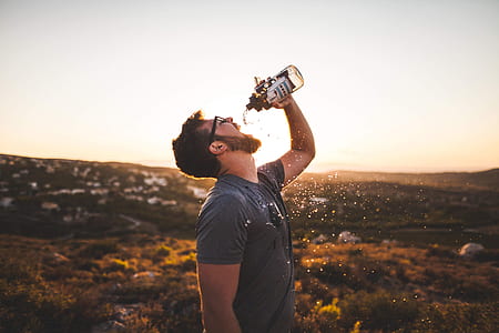 man drinking water from sport bottle thumbnail