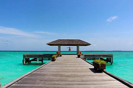 person jumping at the end of dock thumbnail