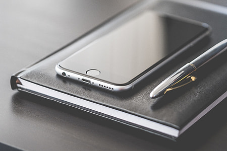 Business Gear: Smartphone, Silver Pen and Diary thumbnail