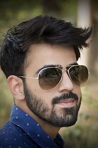 man wearing gold-colored aviator style sunglasses thumbnail