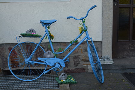 blue cruiser bicycle parked on street thumbnail
