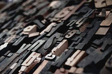 shallow focus photography of embossed letters and special characters thumbnail