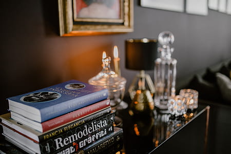 Decanter, candles, and a painting on the wall thumbnail