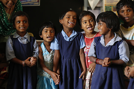 children wearing school uniform making smiling face thumbnail