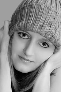 grayscale photography of woman wearing knit hat thumbnail