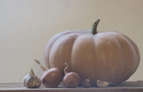 shallow focus photography of pumpkin on top of table thumbnail