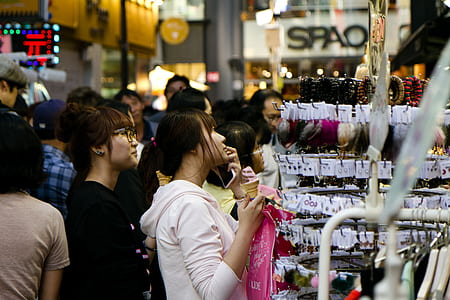 woman standing in front of jewelry rack thumbnail