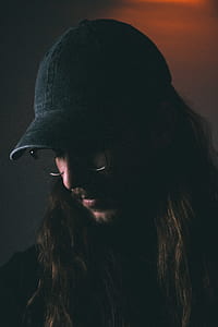 man wearing black dad hat and black framed eyeglasses thumbnail