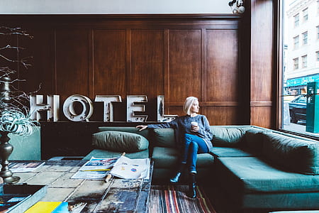 woman sitting holding cup in sofa thumbnail